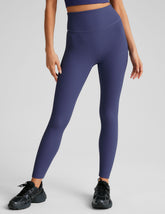 blue midi length leggings with a 4" waistband and no front rise seam.