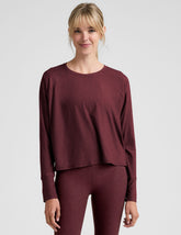 red scoop neck long sleeve relaxed fit top.