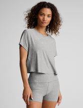gray short sleeve loose-fitting cropped tee with a scoop neckline.