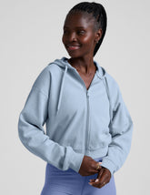 blue fleece zip-up jacket with a drawstring hood.