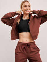 brown fleece zip-up jacket with a drawstring hood.