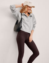 gray cropped long sleeve pullover with a v-neck collared neckline.
