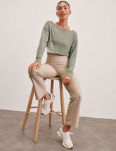 green 2-way long sleeve cropped shrug.