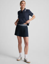 blue mini length pleated skirt with an exposed stripped elastic waistband and 
internal performance shorts with pockets.
