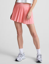 pink pleated mini skirt with an exposed stripped elastic waistband and internal performance shorts with pockets.