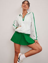 white and green half zip jacket
