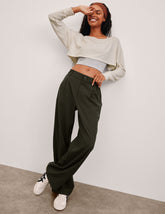 green trouser pants with pockets.