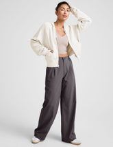 grey mid rise trousers with pockets.