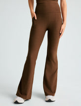 brown high-waisted flare pants with side pockets.