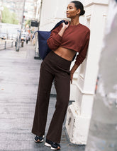 brown mid-rise wide leg pants with pockets.