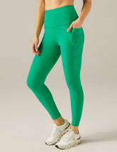 green midi legging with pocket detail at sides