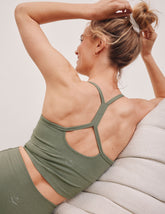 green racerback cropped tank top with thin straps.