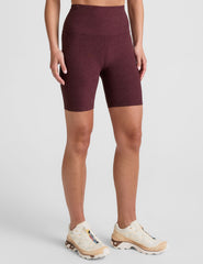 model is wearing red high-waisted 7" inseam biker shorts.