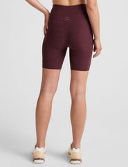 model is wearing red high-waisted 7" inseam biker shorts.