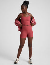 red high-waisted, 3" inseam biker shorts.