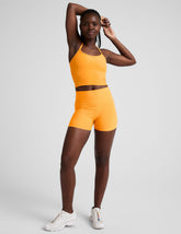 orange high-waisted 3" inseam biker shorts.