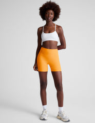 orange high-waisted 5" inseam biker shorts.