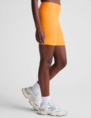 orange high-waisted 5" inseam biker shorts.
