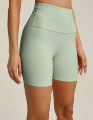 green high-waisted biker shorts with a 5" inseam.
