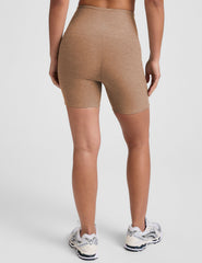 tan high-waisted 5" inseam biker shorts with pockets.