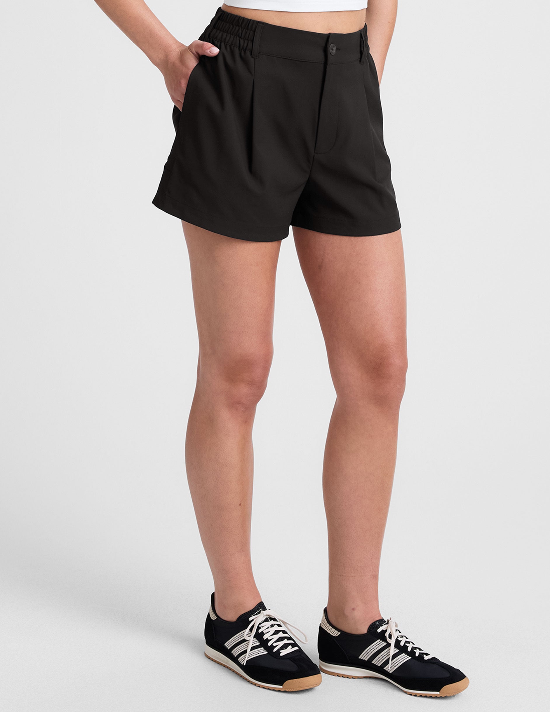 black 4" inseam shorts with an elastic waistband with belt loops​ and side seam pockets. 