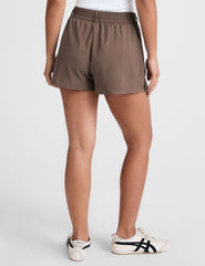 brown shorts with front pleats and side pockets.