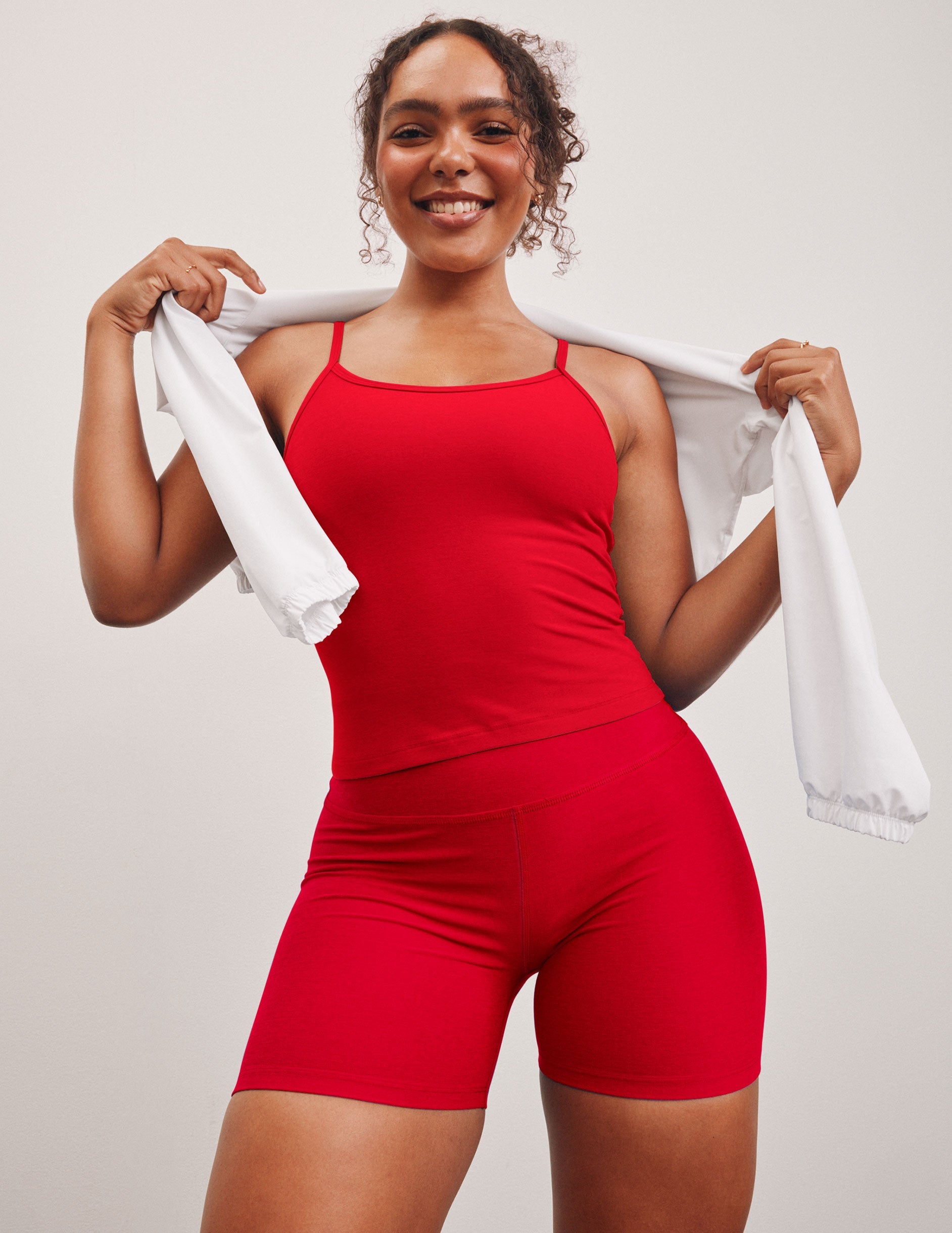 red waist length slim strapped racerback tank.