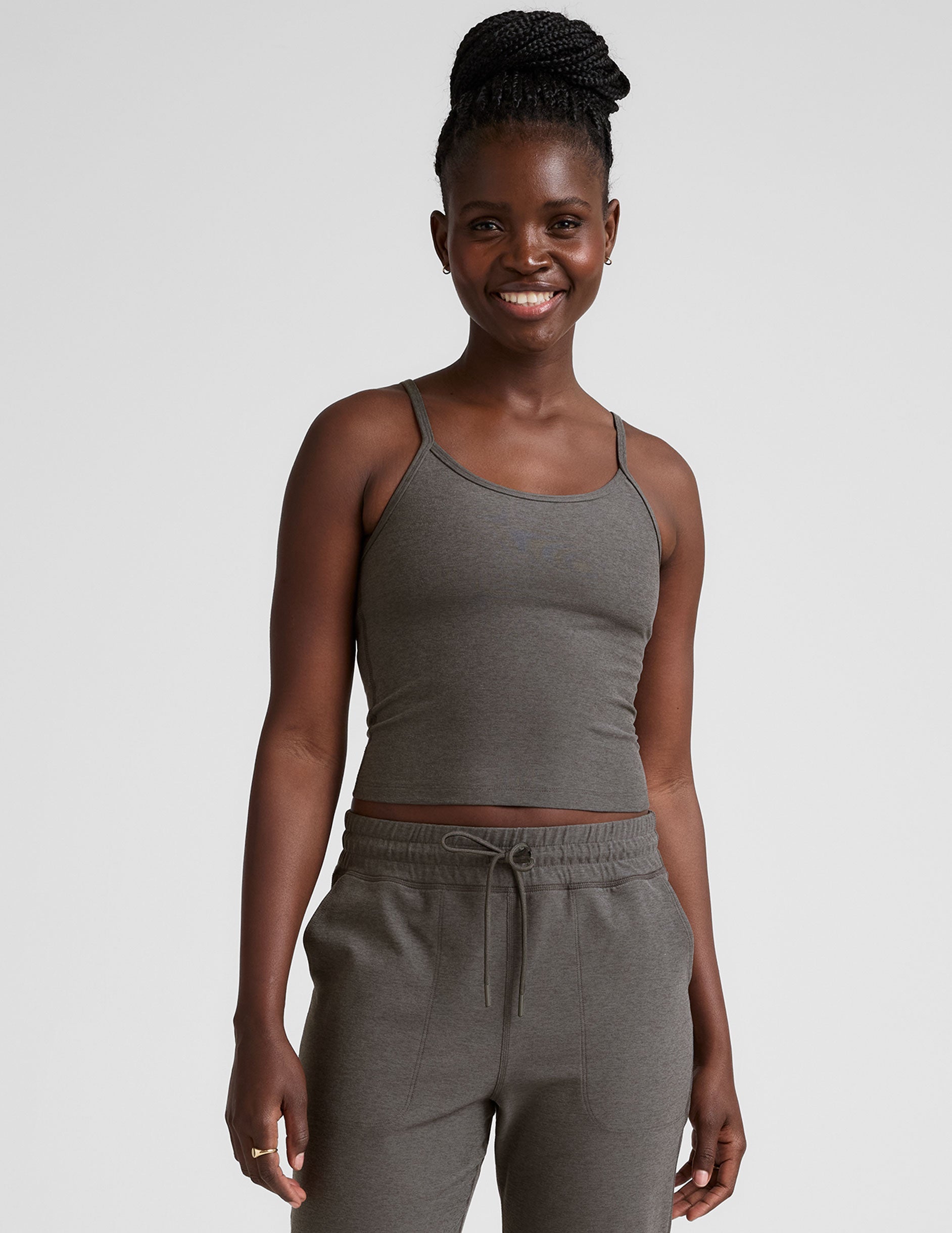 gray waist length tank with adjustable spaghetti straps.