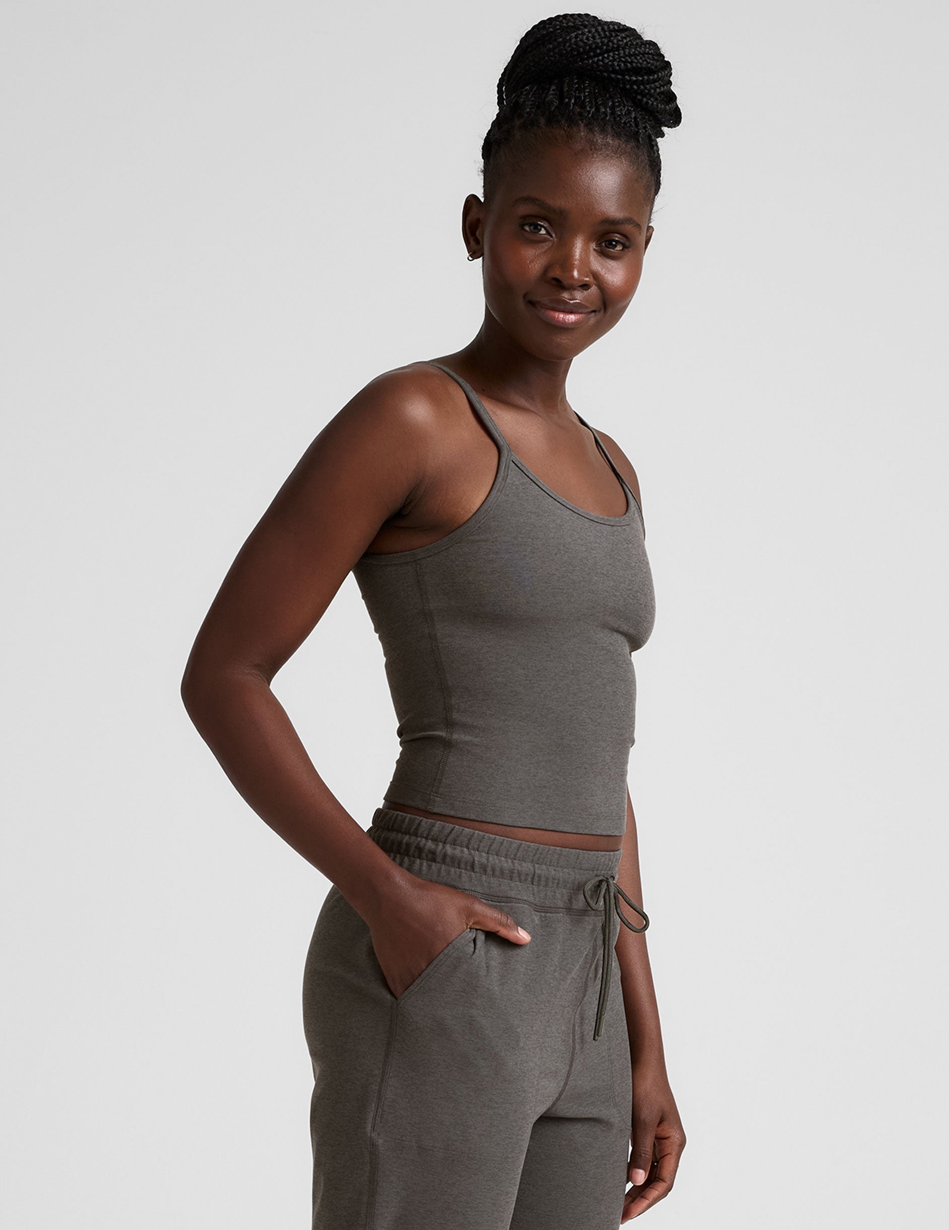 gray waist length tank with adjustable spaghetti straps.