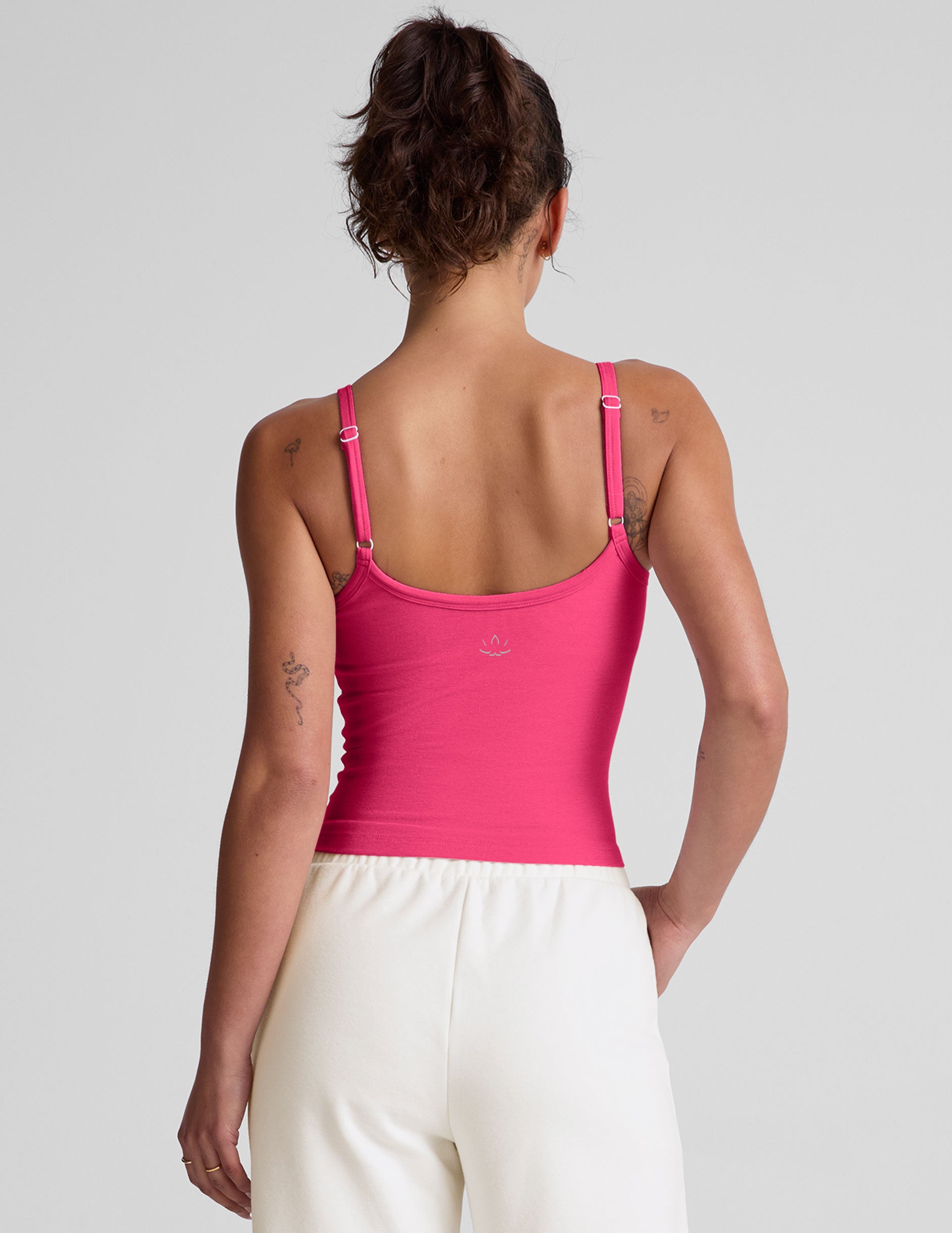 pink waist length tank top with adjustable straps.