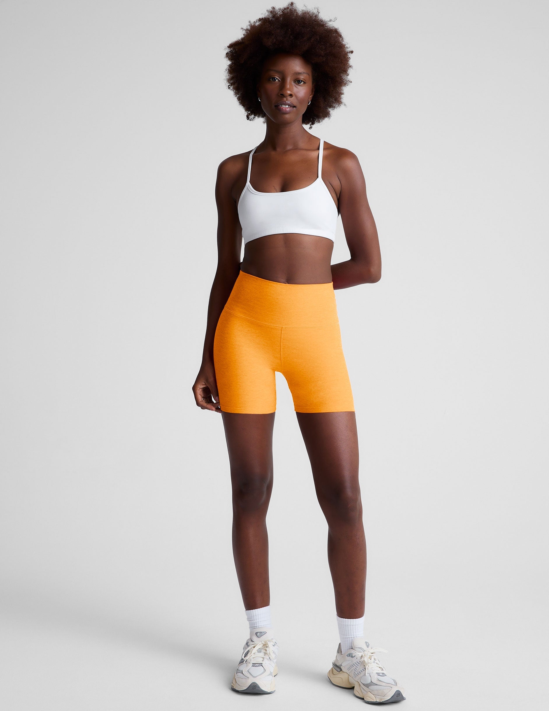 orange high-waisted 5" inseam biker shorts. 