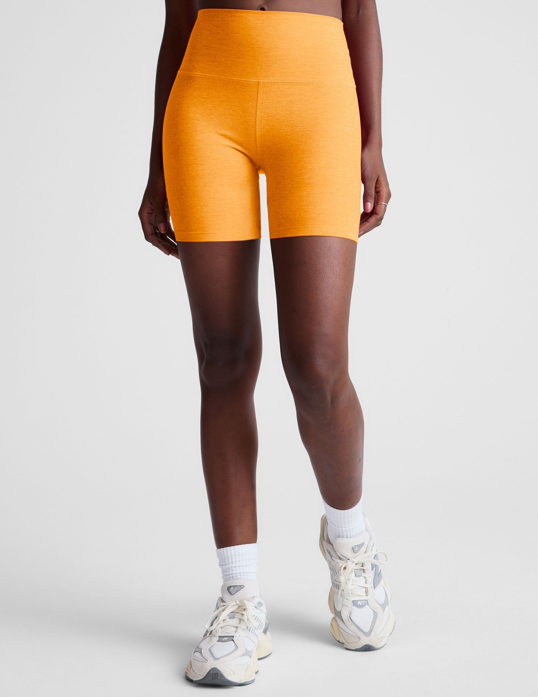 orange high-waisted 5" inseam biker shorts. 