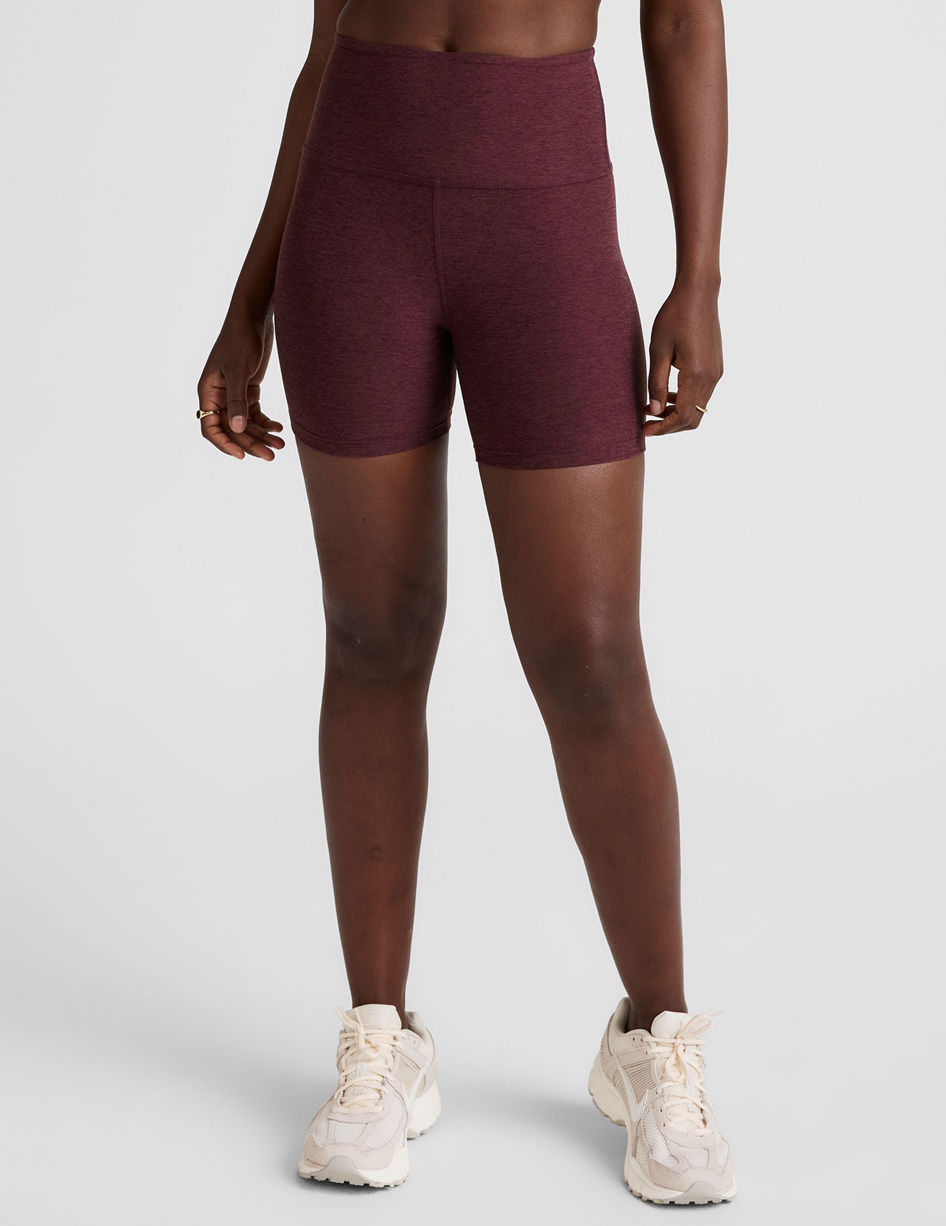 model is wearing red high-waisted 5" inseam biker shorts. 