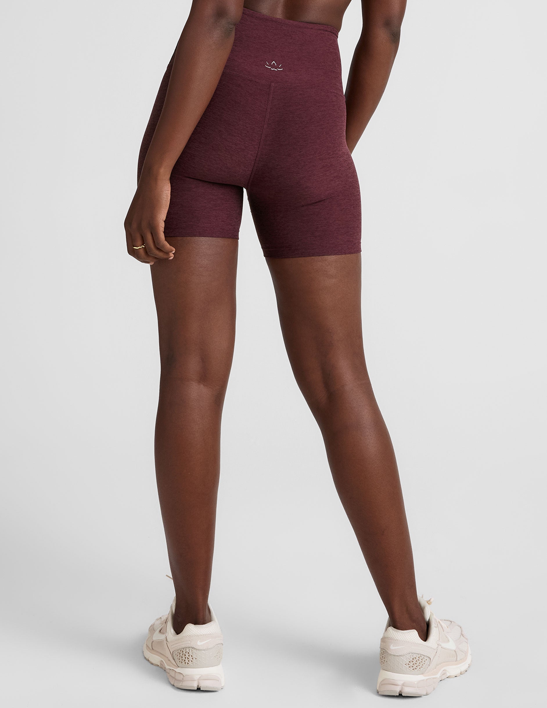 model is wearing red high-waisted 5" inseam biker shorts. 