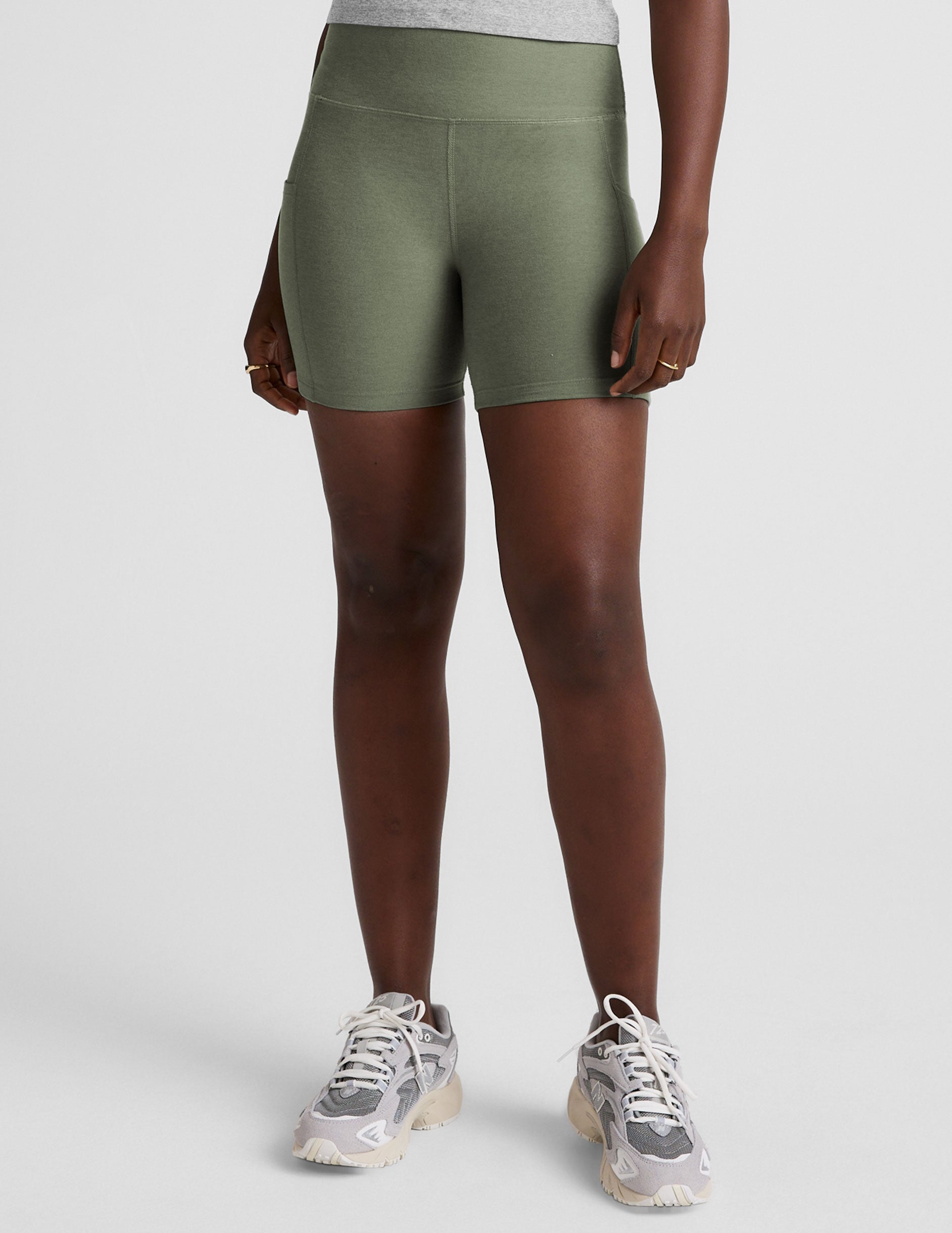 green high-waisted 5" inseam biker shorts  with pockets. 