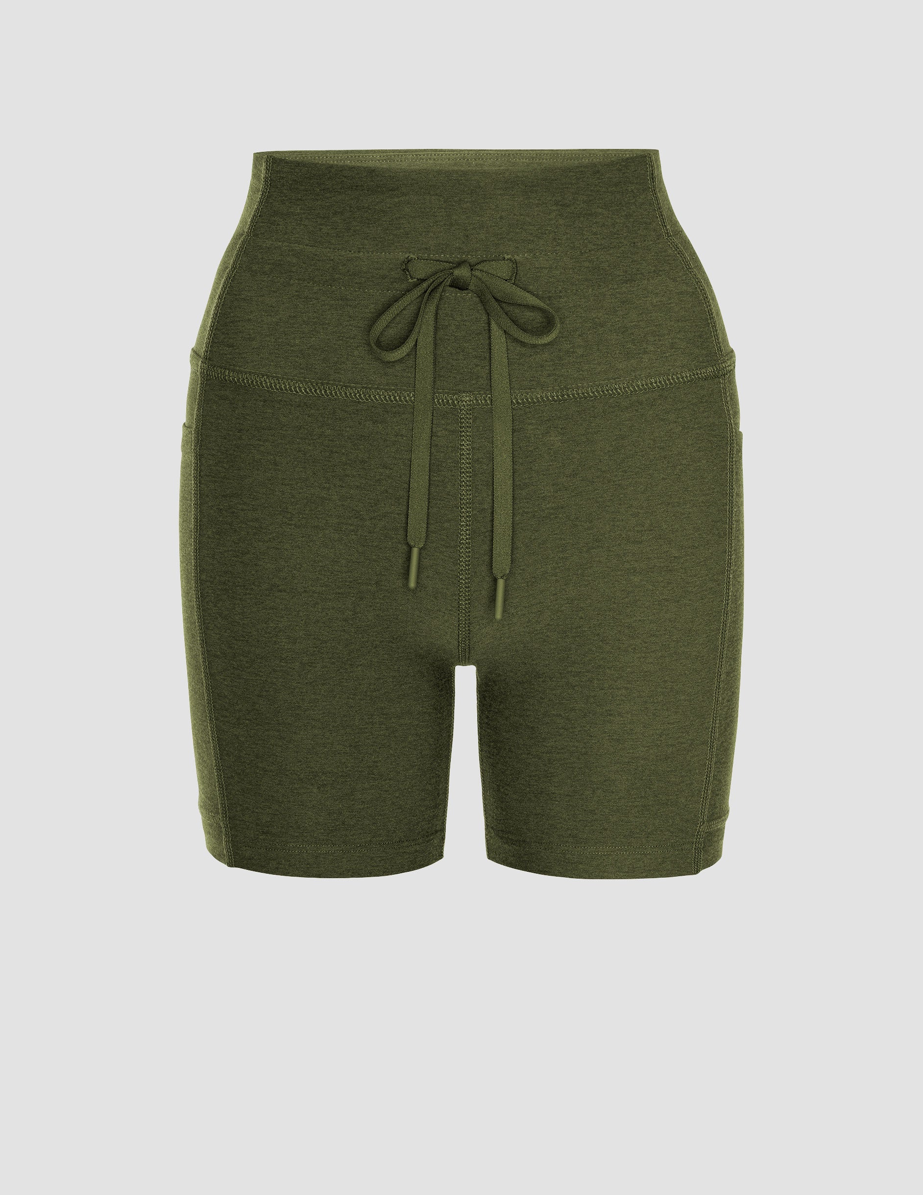 green 5" inseam biker shorts with pockets and a drawcord at waistband. 