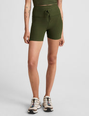 green 5" inseam biker shorts with pockets and a drawcord at waistband. 