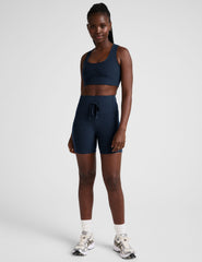 blue high-waisted 5" inseam biker shorts with pockets and a drawstring at waistband. 