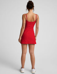 red mini dress with thin straps and built-in shorts with pockets.