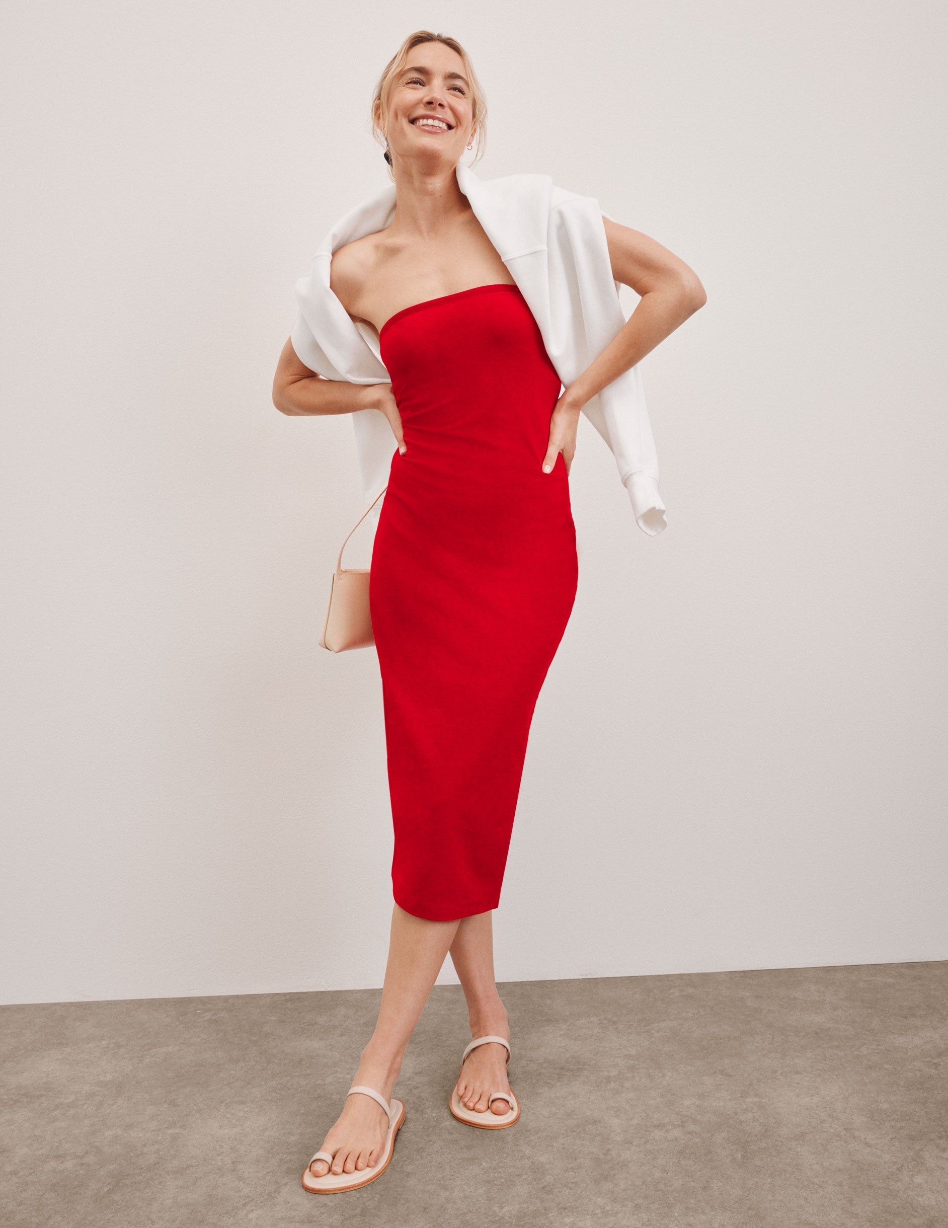 red strapless midi length dress.