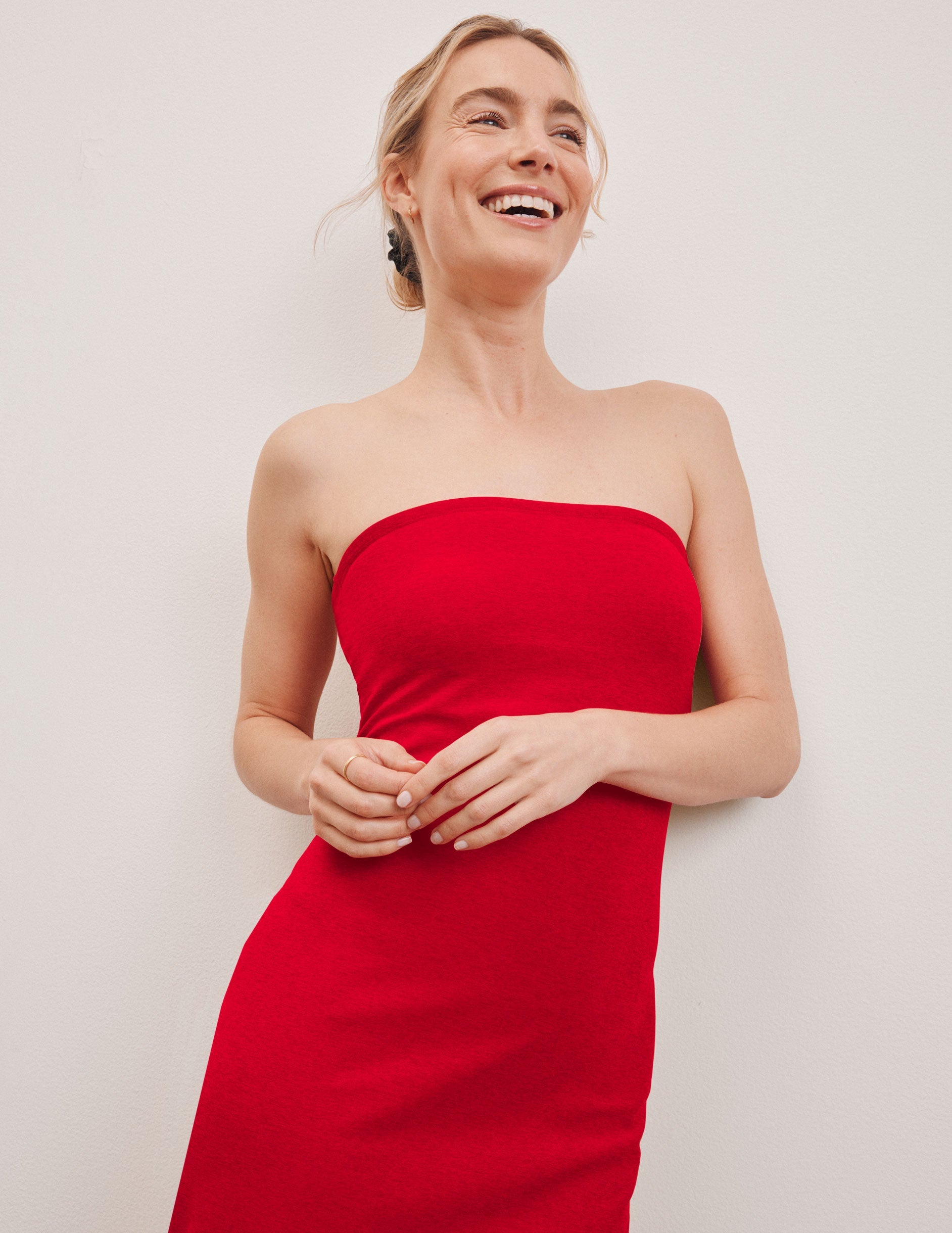 red strapless midi length dress.