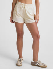 white mid-rise shorts with two side patch cargo pockets and a drawcord at waistband.
